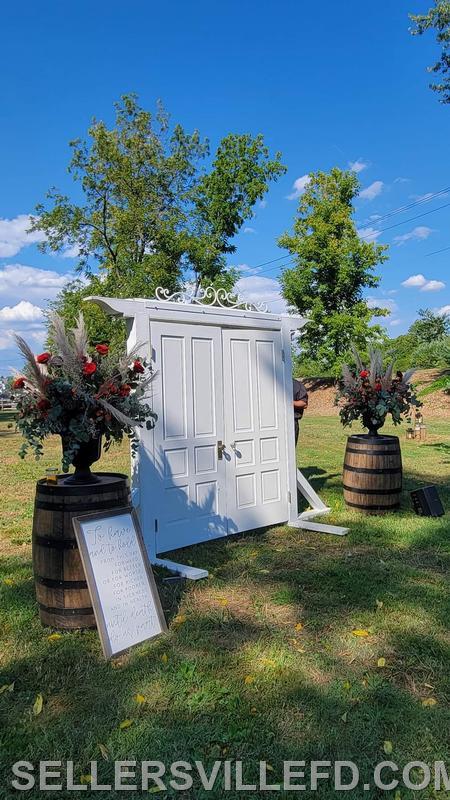 Rustic Doorway with 2 of our whiskey barrels 